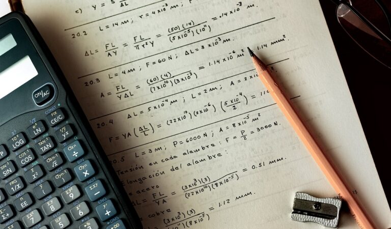A dad is teaching his son how to do math. A dad is teaching his son how to do math.